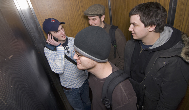 Sophomores Andrew Jardy, newspaper journalism major; David Rowe, electronic media production major; Rex Santus, newspaper journalism major and Bryan Pilny, newspaper journalism major, ride the Olson Hall elevator. EMT stretchers cannot fit into the elevator, which is raising safety concerns Matt Hafley