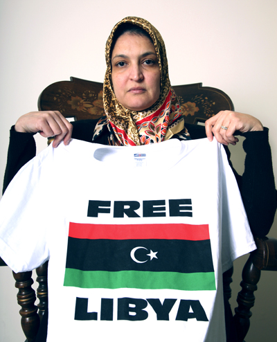 Libyan Education graduate student Amal Laba displays a shirt calling to free Libya Wednesday. Photo by Thomas Song.
