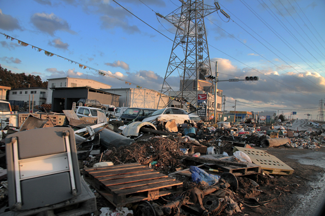 Debris piles up at a local gas station in Sendai, Japan on Thursday. Cleanup efforts have made some areas hit by the tsunami passable, but much more work is needed to fix the catastrophic damage. Photo by Thomas Song.