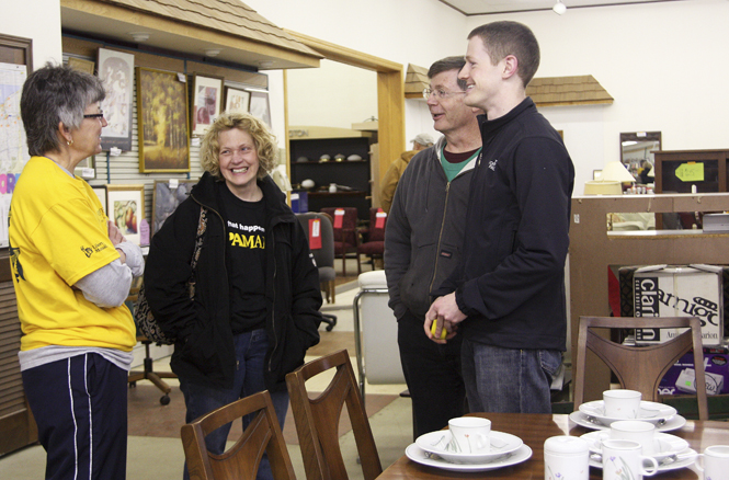 (From left) Karen Schofield, class of 1976, Julie Dietz, class of 1976 and 1979, George Dietz, class of 1980, and son Michael Dietz take a moment to chat at the Habitat for Humanity ReStore in Kent on Saturday. The Alumni Association encouraged Kent State alumni across the nation to give back to the community by donating their time during the third annual National Day of Service. Photo by Valerie Brown.