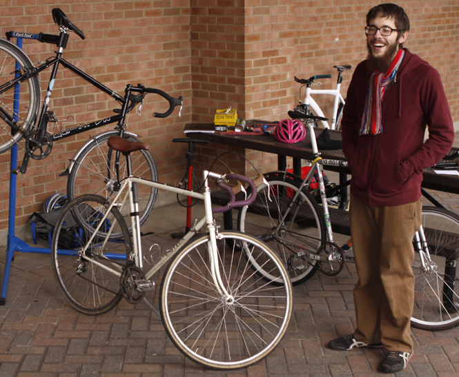 Josh Goran, 23, teaches a bike workshop at Risman Plaza on Wednesday. The workshop is being held at the student center for the next four weeks to inform students about proper bike safety. Photo by Nikolas Kolenich.