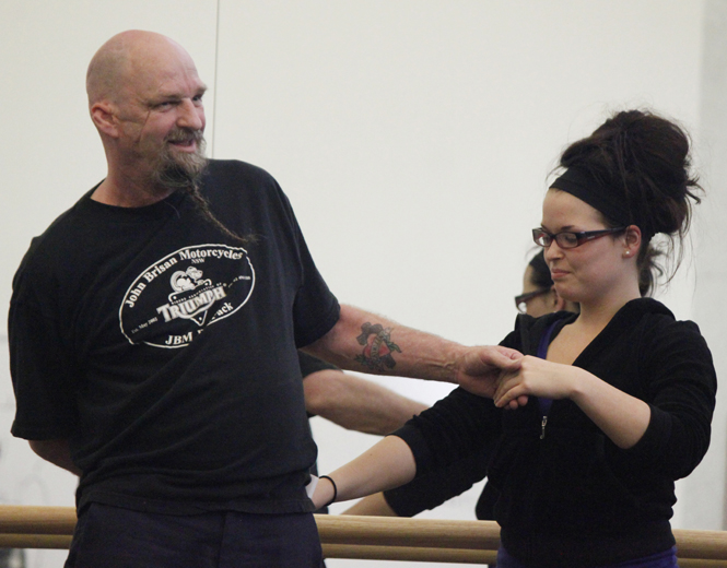 52-year-old maintenance worker Mark Clark practices moves during swing dancing class last Tuesday. Clark has been working in the Music and Speech Building for over two years and decided to join the class after he saw how much fun students were having. Photos by Jessica Yanesh.