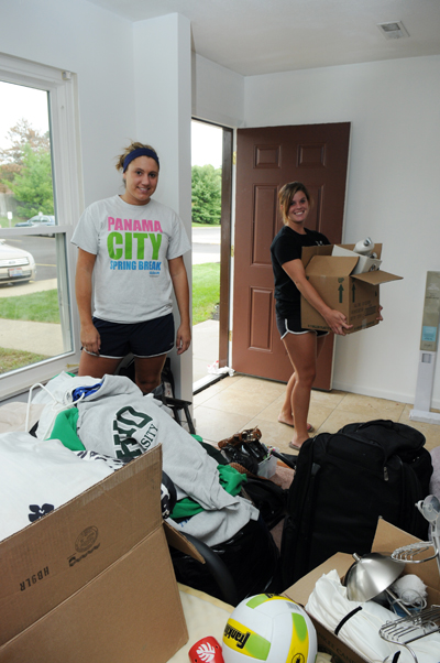 Senior Physical Education majors, Lauren Jasica and Rachael Lyons move boxes in their new apartment. Jasica and Lyons were told the original move in date of last Tuesday but had to wait for their apartment to get finished until Thursday. Photo by Philip Botta.