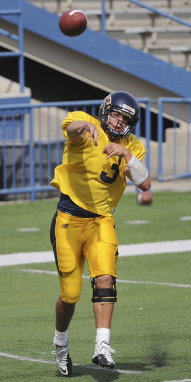 Junior quarterback Spencer Keith throws a pass during practice yesterday August 30th at Dix Stadium. Photo by Philip Botta.