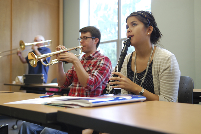 Abby Mariano, a fifth year music education and clarinet performance double major, and Brian Rizzo, a fifth year music education major, sit in Chas Bakers Jazz Ensemble Techniques and Literature class in the Music and Speech Building on Wednesday, Sept. 7. Baker has been teaching Jazz studies at Kent since 1977 and is pleased with the new Jazz minor offered. I love it, Baker said. Ive been wanting to do the Jazz minor for about 25 years. Photo by Nancy Urchak.