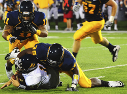 Senior linebacker Dorian Wood tackles a Murray State player. Photo by Erinn Best.