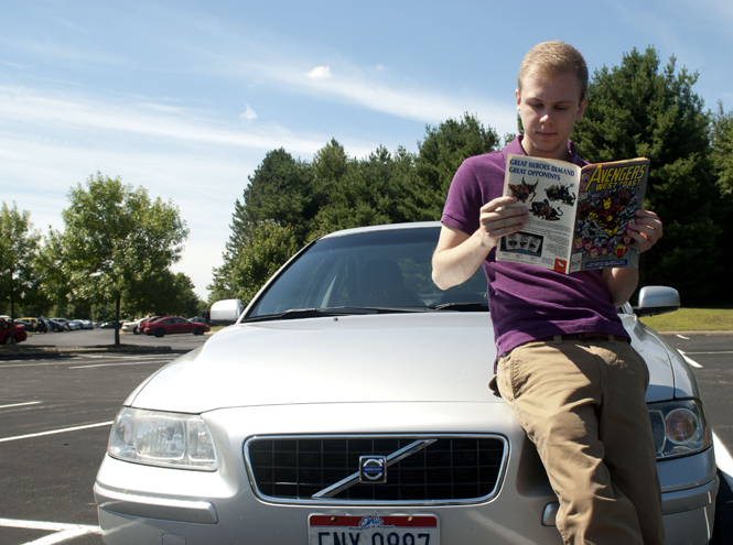 Michael A. Brahler, junior psychology major, with his 2005 Volvo s60 was chosen to appear as an extra in the upcoming Avengers film being shot in Cleveland. For his part, he drove around a section of Cleveland that had been mocked-up to look like New York City for a few hours. “It still blows my mind,” said Brahler, who fears that his small part will wind up on the cutting room floor.. Photo by SAM VERBULECZ.