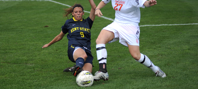Junior midfielder Megan Repas battles Bowling Green defender Alyssa Carmack for control of the ball on Sunday, Sept. 25. The Flashes beat the Falcons 1-0. Photo by Kristin Bauer.
