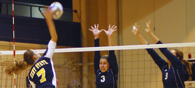 Outside Hitter Maigan Larsen spikes the ball. Photo by Sam Verblecz.