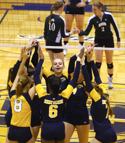 The Kent State volleyball team got psyched up for the third period against Ohio University on Sept. 29th. Unfortunately, the Flashes lost three periods to zero. Photo by Sam Verbuelcz.
