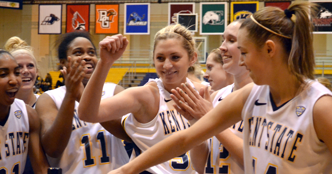 Junior center Leslie Schaefer, celebrates with the rest of the team over their victory against Buffalo on Thursday, Jan. 19. The Flashes won 85-73. Photo by Emily Martin.