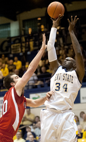 Kent State senior forward Justin Greene keeps the ball away from Miami as he scores on Wednesday, Jan. 11. The Flashes beat the Redhawks 71-67. Photo by Kristin Bauer.
