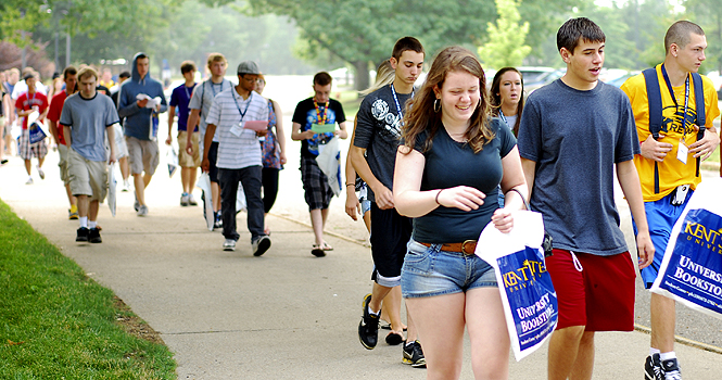 A group of incoming freshman head out from Eastway Hall and to the Kiva for a presentation on life at Kent State. From there, students broke off on their own for advising appointments, ending their trip with Destination Kent State. Photo by Sam Verbulecz.
