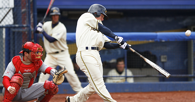 Sophomore outfielder T.J. Sutton makes contact with a pitch against Youngstown State at Schoonover Stadium on Wednesday, April 11. Kent State defeated Youngstown State 14-4. Photo by Anthony Vence.