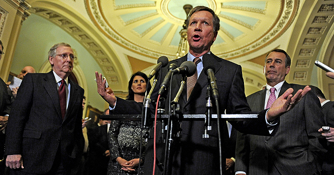 Ohio Governor-elect John Kasich talks to reporters after meeting with House Speaker-designate John Boehner (R-Ohio), right, Senate Minority Leader Mitch McConnell (R-Ky.), left, and other GOP Governors-elect at the United States Capitol in Washington, D.C., Wednesday, December 1, 2010. Photo courtesy of (Mary F. Calvert/MCT).