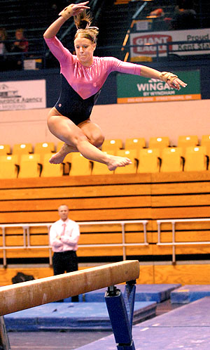 Sophomore Marie Case jumped on the balance beam during Kent States meet against Western Michigan during last years Flip for the Cure on Feb. 27. The Gymnastics team will go against Northern Illinois on Sunday, Feb. 19 at 1 p.m. in this years Flip for the Cure meet. Photo by Jackie Friedman.