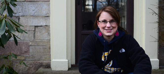 Andrea Whaley, junior integrated health studies major, outside her childhood home in Kent, Ohio. Photo by Jacob Byk.