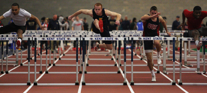 Mike Schober, senior Sports Administration major, competes in the preliminary heat for the Mens 60 meter hurdle.. Photo by Valerie Brown