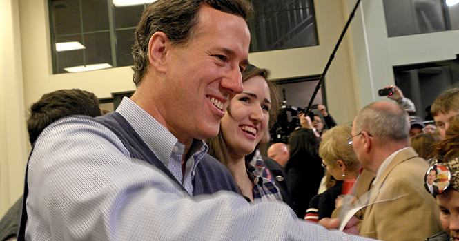 Rick+Santorum+signs+posters+after+his+campaign+speech+Monday+night+in+Cuyahoga+Falls.+Photo+by+Britni+Williams.