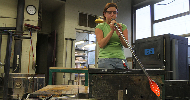 Junior Brenda Balut works on her glass blowing project in the Schwartz Center, April 25. Photo by Chelsae Ketchum.