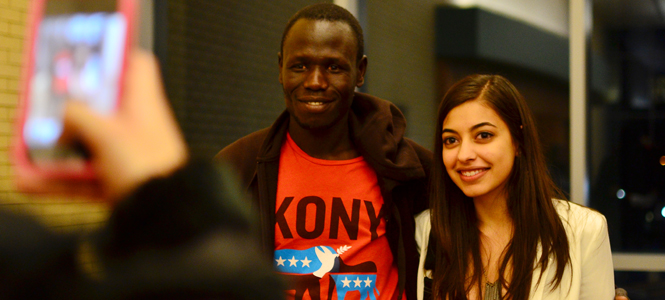 Reshmi Mehta, sophomore political science major and member of Kent States Invisible Children chapter posed for a picture with Richard Olunya, an engineer working to build schools in the northern region of Uganda. Photo by Jacob Byk.
