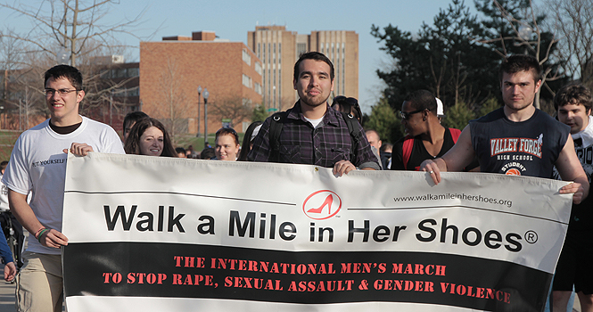 Students participate in last years Walk a Mile in Her Shoes. File photo by Rachel Kilroy.