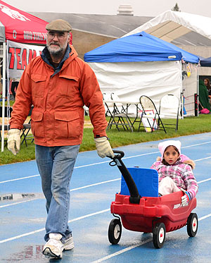 Robert Cargile and Maya Cargile walk at the Relay for Life walk, April 21. They walked in honor of Roberts father who lost his life last year to cancer. The walk was held at Kent States running track. Photo by Emily Martin.