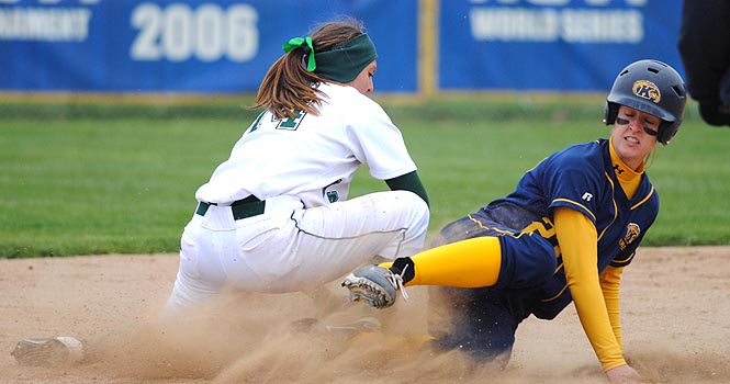 Senior Mary Holt made a safe slide into second during the Flashes game against Eastern Michigan on Saturday, March 31. Kent State won with a final score of 6-1. This was the teams fourth consecutive win of the season. Photo by Jenna Watson.