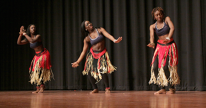 Sedaekon Butler, Lemay Butler and Garmai-Korto Mattew perform as African Dance Pride group, during the Kent African student association “A time to reconnect” in the student center ballroom on March 30. Photo by Brian Smith.