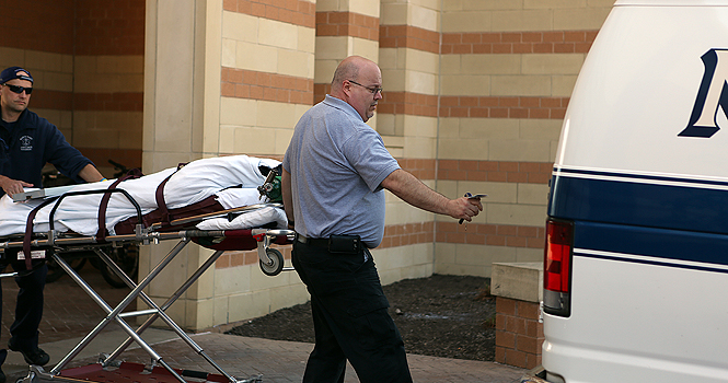 A body was loaded into an ambulance in front of Centennial Court C on Friday. Photo by Coty Giannelli.