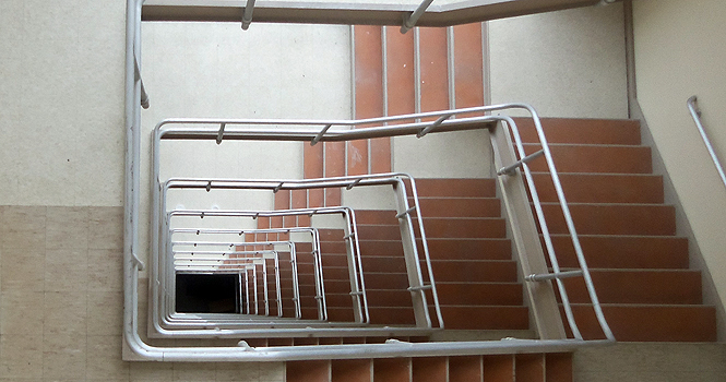 The unused winding staircase in the University Library goes from the 12th floor to the basement. It poses a danger because someone could potentially fall the entire way down. Photo by Walter Doerschuk.