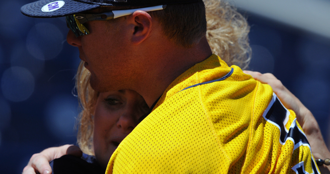 “I’m very proud of him,” said Mari Sutton, mother of T.J. Sutton, as she hugs her son holding back the tears after the Flashes second and final loss at the College World Series in Omaha, Neb., Thursday, June 21. Photo by Philip Botta.