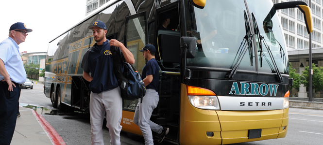 Members of the Kent State University Baseball team arrive at their hotel after practicing at an indoor batting cage because of the rain-storms blanketing the Omaha, Nebraska region Friday, June 15. Photo by Philip Botta.