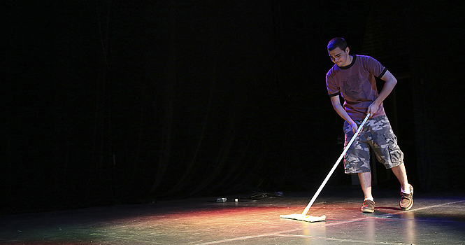 Ethan Simpson sweeps the stage at the Kent Stage on Tuesday. The Kent Stage celebrated its 10-year anniversary in January 2012. Photo by Coty Giannelli.