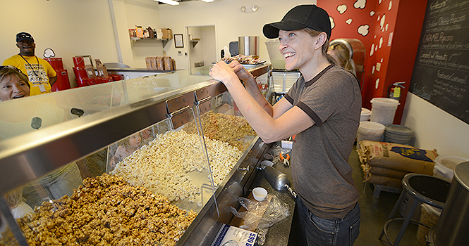 I try to keep it as locally based as I can, said Gwen Rosenberg, 38, of Kent. Rosenberg is the owner and manager of Popped!, located in Acorn Alley II. She makes all her popcorn daily from scratch, and said that all the ingredients she uses are from Ohio. Photo by Matt Hafley.