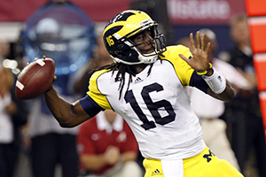 Michigan+quarterback+Denard+Robinson+throws+and+completes+a+pass+against+Alabama+in+the+first+half+of+the+Cowboys+Classic+at+Cowboys+Stadium+in+Arlington%2C+Texas%2C+Saturday%2C+September+1%2C+2012.+Photo+by+%28Julian+H.+Gonzalez%2FDetroit+Free+Press