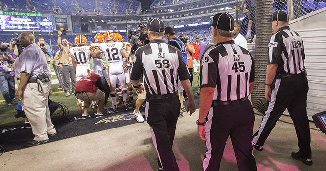 Side judge Jimmy DeBell (58), line judge Jeff Seeman (45), and umpire Bill Schuster (129) take to the field before their first game back after a lockout. Theyre ready to officiate the game in Baltimore, Maryland, on Thursday, September 27, 2012, between the Ravens and Cleveland Browns. Photo courtesy of MCT Campus.