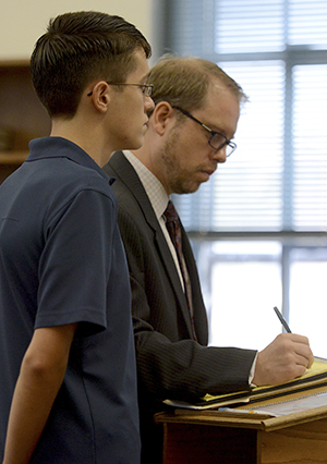 William Koberna and his attorney Paul Cristallo are addressed by Judge Barbara Oswick during an arraignment hearing on August 3 in the Kent Municipal Court. Koberna is no longer facing felony charges of inducing panic after making threats on Twitter of 