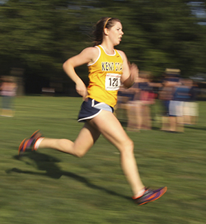 Freshman Brigid Callaghan runs during the Tommy Evans Cross Country Invitational on Thursday afternoon in Firestone Park in Akron. Photo by Brian Smith.