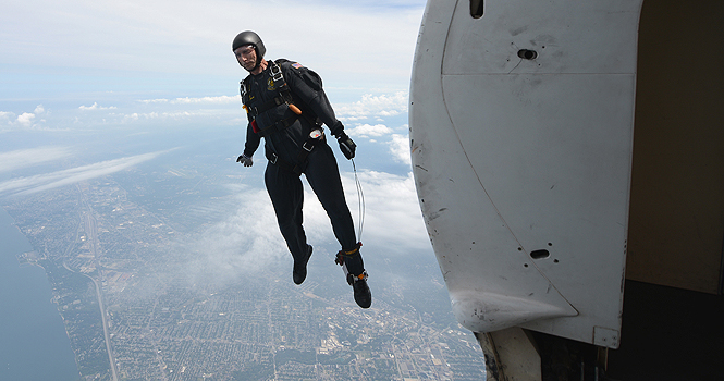 Chris Clark jumps from the Golden Knights C-31A Friendship aircraft during a demonstration for the Cleveland National Air Show on September 1st. Clark, as well as the rest of the Gold team, jumped from 12,500ft and landed precisely on an X at show center. Photo by Matt Hafley.