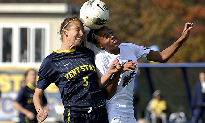 Junior Megan Repas, forward, battles Ohio University defense player Remi Famodu for control of the ball after the ball was kicked back into play on Sunday, Oct. 23, 2011. The Flashes beat the Bobcats 1-0. Photo by Kristin Bauer.
