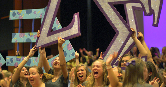 Sigma Sigma Sigma sisters get excited as the new sorority recruits enter the KSU Ballroom for Bid Night. Photo by Rachael Le Goubin.