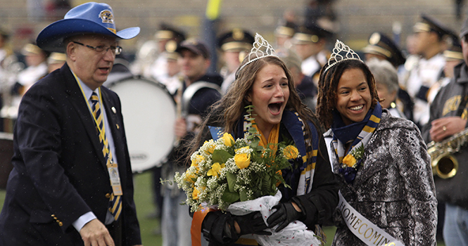 Ann Miller yells for joy after discovering that she is the Kent State 2012 Homecoming Queen. Miller was crowned during the Halftime of the Homecoming game on Oct. 20. Photo by BRIAN SMITH.