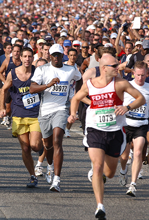 Sean P. Diddy Combs, center, wearing white hat, takes on the challenge of the 2003 ING New York City Marathon as he starts running on the Verrazano bridge along with tens of thousands of other participants, in New York, on Sunday, November 2, 2003. (nk) 2003. Photo by Nicolar Khayat/ABACA Press