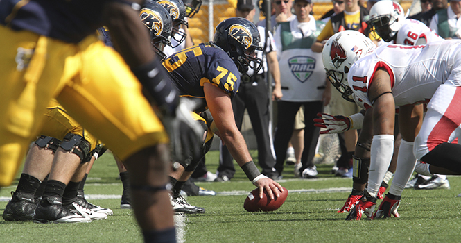 Offensive linemen Phil Huff is ready to pass the ball at Dix Stadium on Sept. 29. Kent State won the game 45-43. Photo by BRIAN SMITH.