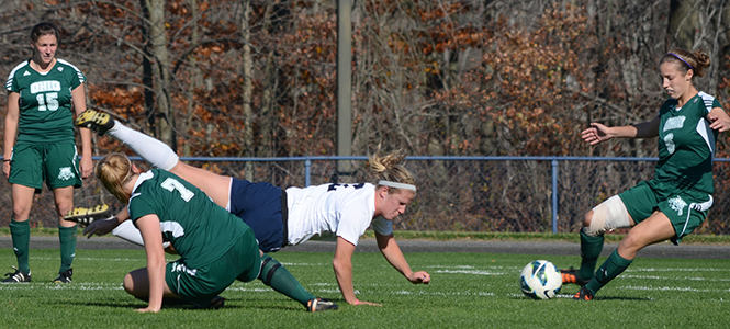 Ohios Paige Howard steals the ball as freshman midfielder Madison Helterbran trips over Erin Feeney during a game against Ohio on Thursday. The Golden Flashes beat the Bobcats 3-0. Photo by MARIELLE FORREST.