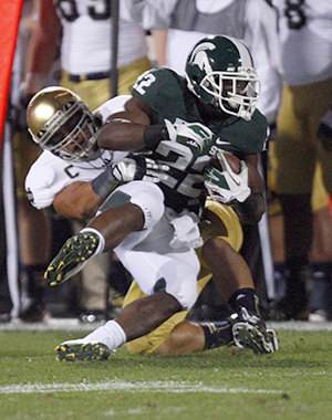 Michigan States Larry Caper (22) is tackled by Notre Dames Manti Teo during first-quarter action on Saturday, September 15, 2012, at Spartan Stadium in East Lansing, Michigan. Photo by Kirthmon F. Dozier/Detroit Free Press/MCT.
