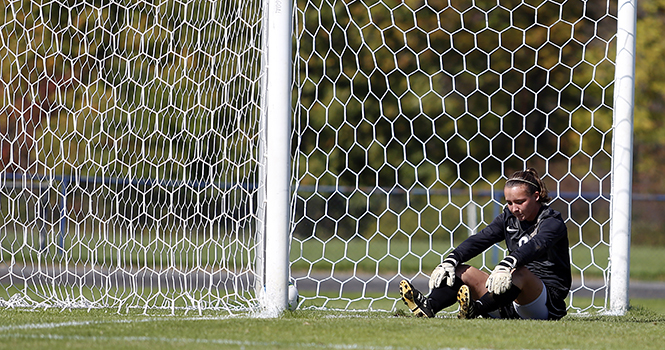 Freshman Goal Keeper Stephanie Senn sits in the goal area after the Miami Red Hawks score their third goal against the Goldern Flashes on Sunday. Kent State was unable to defeat the Red Hawks, losing the game 4-2. Photo by Coty Giannelli.