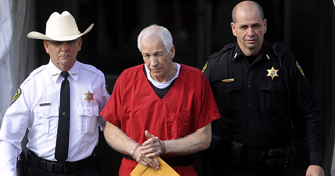 Jerry+Sandusky%2C+center%2C+is+escorted+from+his+sentencing+at+the+Centre+County+Courthouse+in+Bellefonte+on+Tuesday%2C+October+9%2C+2012.+Sandusky%2C+maintaining+his+innocence%2C+was+sentenced+Tuesday+to+at+least+30+years+in+prison%2C+effectively+a+life+sentence%2C+in+the+child+sexual+abuse+scandal+that+brought+shame+to+Penn+State+and+led+to+coach+Joe+Paternos+downfall.+%28MCT%29