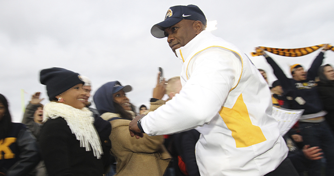 Head Coach Darrell Hazell runs back to the locker room after leading his team to victory against Akron during the Wagon Wheel Challenge at Dix stadium. Photo by BRIAN SMITH.